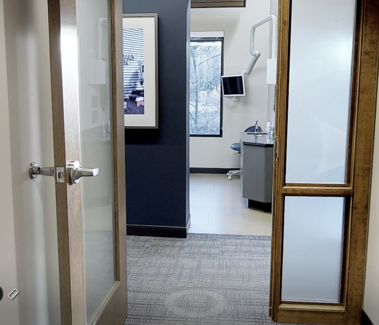 Entering the clinical hallway. Partial view of one of the windows in natural light-filled exam rooms.